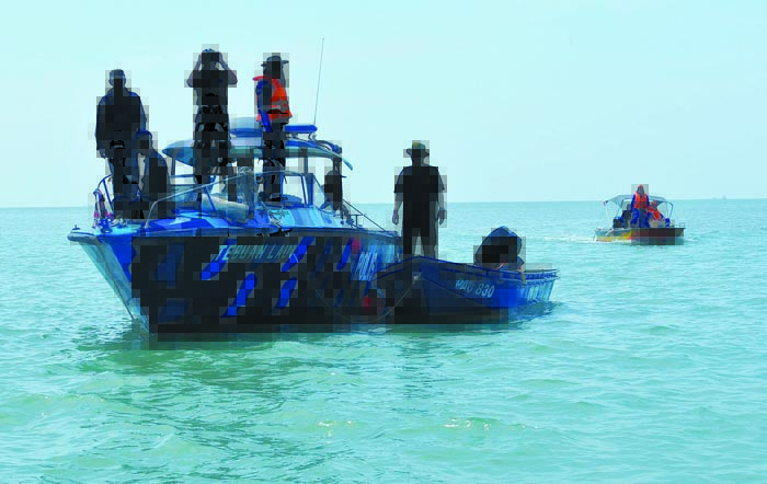 Marine police personnel during the search and rescue operation. u00e2u20acu201du00c2u00a0Picture by Sayuti Zainudin