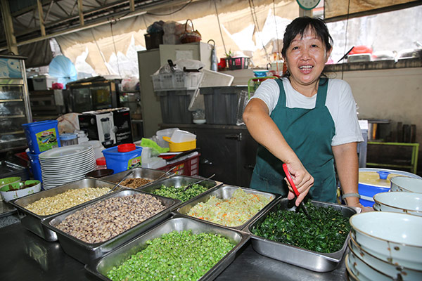 Madam Lee spends hours prepping the vegetables for her lui cha