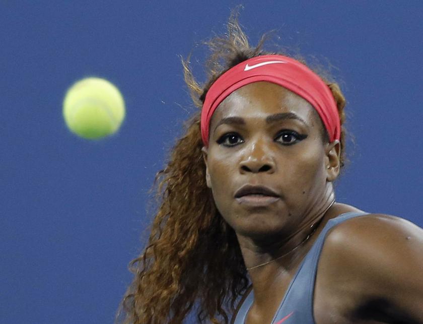 Serena Williams of the U.S. keeps her eyes on the ball as she plays against Carla Suarez Navarro of Spain at the U.S. Open tennis championships in New York, September 3, 2013