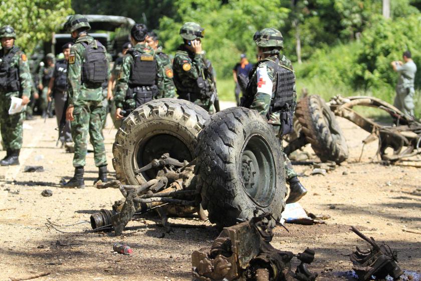 Thai security personnel inspect the wreckage of a military truck after a bomb attack by suspected Muslim militants on a roadside in Yala province, south of Bangkok June 29, 2013. u00e2u20acu201d Reuters pic