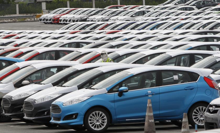 An employee walks among vehicles at AutoAlliance Thailand, a Ford and Mazda joint venture plant, located in Rayong province, east of Bangkok September 17, 2013. u00e2u20acu201d Reuters pic