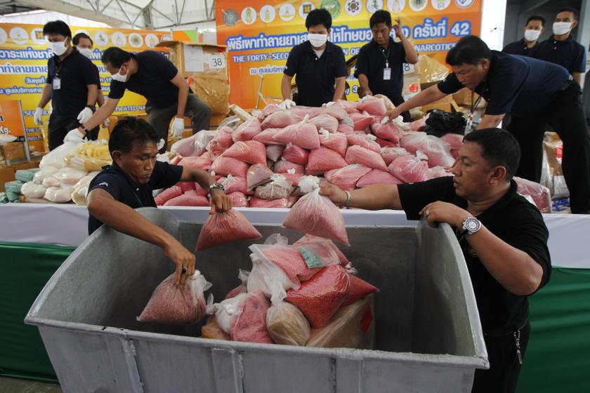 Thai narcotics officials put bags of methamphetamine pills into a bin during the 42nd Destruction of Confiscated Narcotics ceremony in Ayutthaya province, June 26, 2013. u00e2u20acu201c Reuters pic