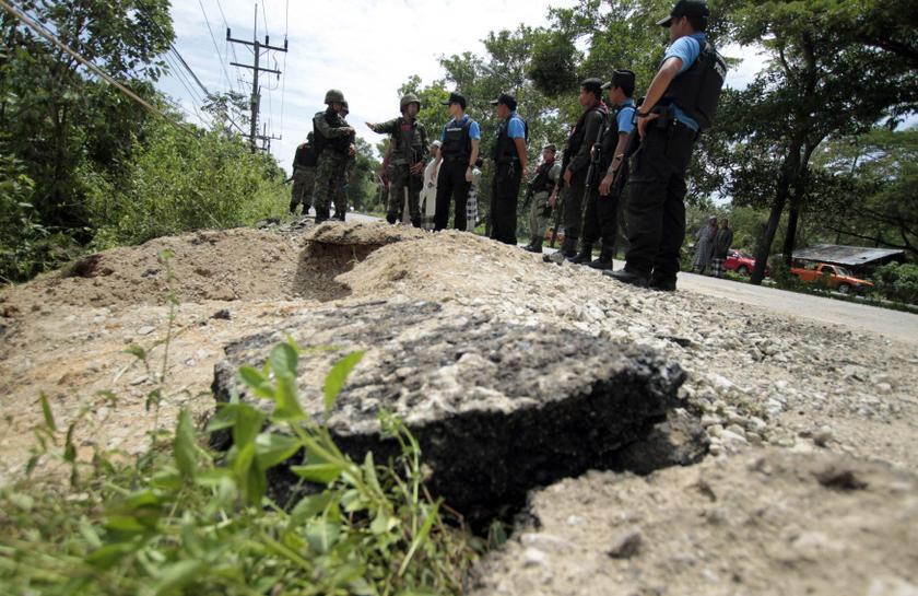 Security personnel inspect the site of a roadside bomb attack in Narathiwat province, south of Bangkok October 28, 2013. u00e2u20acu201d Reuters pic