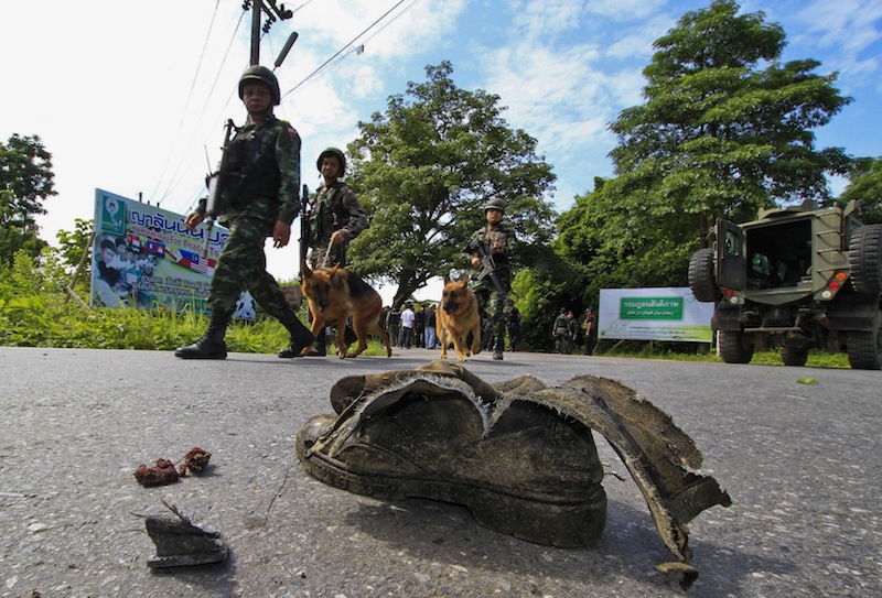 Thai security personnel inspect the site of a bomb attack on a roadside in Yala province, south of Bangkok, August 5, 2013. Five field army soldiers were injured in the attack by suspected Muslim militants. u00e2u20acu201d Reuters pic