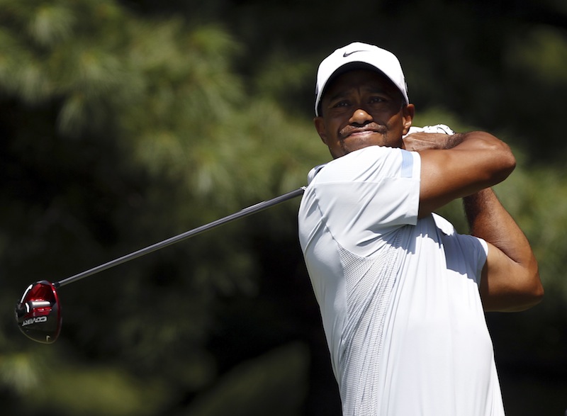 Tiger Woods of the US watches his tee shot on the second hole during the third round of the WGC-Bridgestone Invitational in Akron, Ohio, August 3, 2013. u00e2u20acu201d Reuters pic