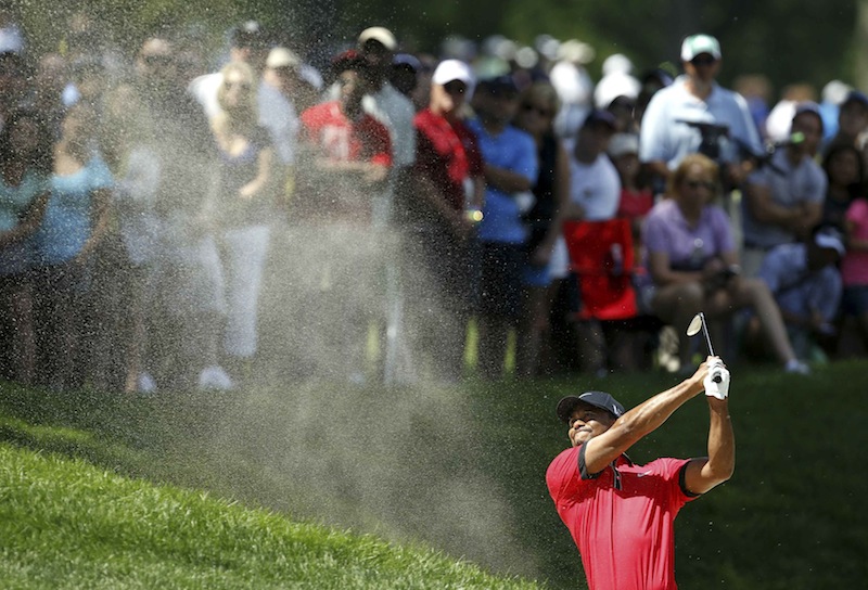 Tiger Woods of the US hits his second shot on the second hole from the sand during the final round of the WGC-Bridgestone Invitational in Akron, Ohio, August 4, 2013. u00e2u20acu201d Reuters pic