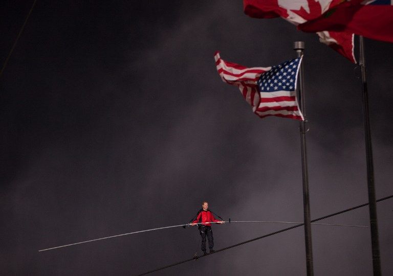 Tightrope walker, Nik Wallenda crosses Niagara Falls on a wire, June 15, 2012. u00e2u20acu201d AFP pic
