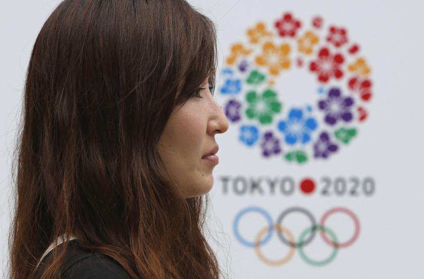 A woman passes a host city logo of Tokyo 2020 Bid Committee at Tokyo Metropolitan Government Building in Tokyo September 8, 2013. u00e2u20acu201c Reuters pic