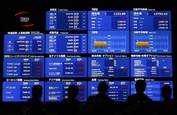 Visitors watch an electronic board showing Japanu00e2u20acu2122s Nikkei prices and related indexes at Tokyo Stock Exchange (TSE) in Tokyo April 24, 2013. u00e2u20acu201d Reuters pic