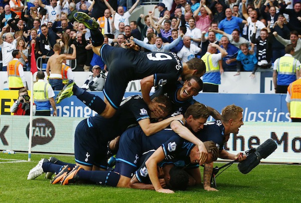 Tottenham Hotspur players celebrate a goal by Paulinho (obscured) during their English Premier League match against Cardiff City in Wales September 22, 2013. u00e2u20acu201d Reuters pic