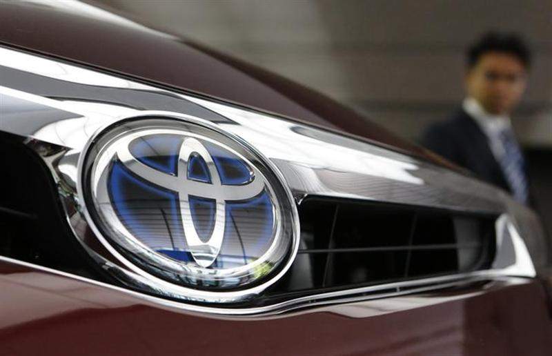 File photo of a visitor looking at a Toyota Motor car at the companyu00e2u20acu2122s showroom in Tokyo on May 8, 2013. u00e2u20acu201d Reuters pic