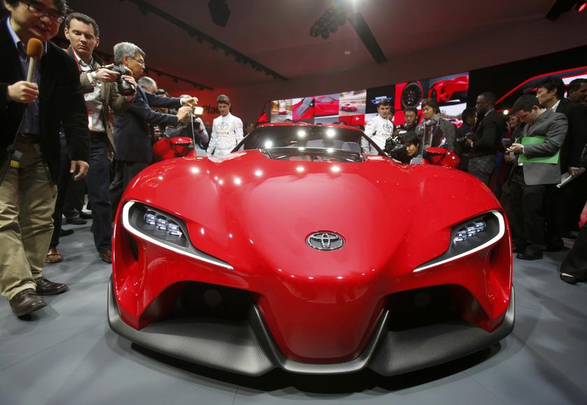 Members of the media surround the Toyota FT-1 concept car as it is unveiled on stage during the press preview day of the North American International Auto Show in Detroit, Michigan January 13, 2014. u00e2u20acu2022 Reuters pic
