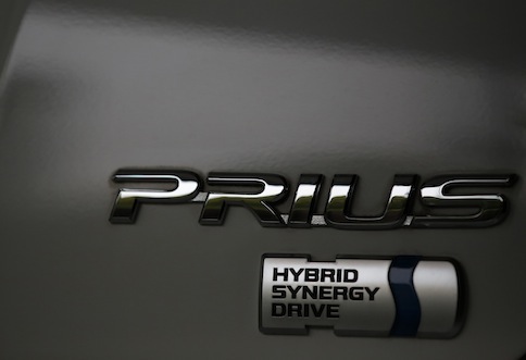 The logo of Toyota Motor Corpu00e2u20acu2122s Prius hybrid car is seen on its body at the companyu00e2u20acu2122s showroom in Tokyo April 17, 2013. u00e2u20acu201d Reuters pic