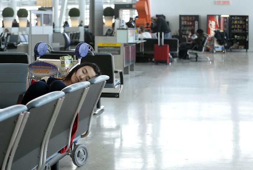 A traveller passes the time at Pearson International Airport Terminal One in Toronto, January 7, 2014.u00c2u00a0u00e2u20acu201d Reuters pic