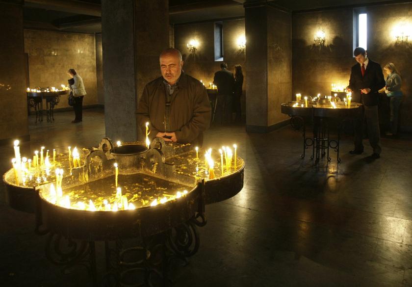 People light candles during a religious service to mark the anniversary of mass killings of Armenians in 1915. — Reuters file pic