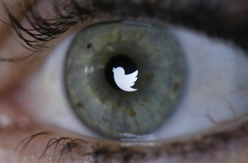 An illustration picture shows the Twitter logo reflected in the eye of a woman. u00e2u20acu201d Reuters pic