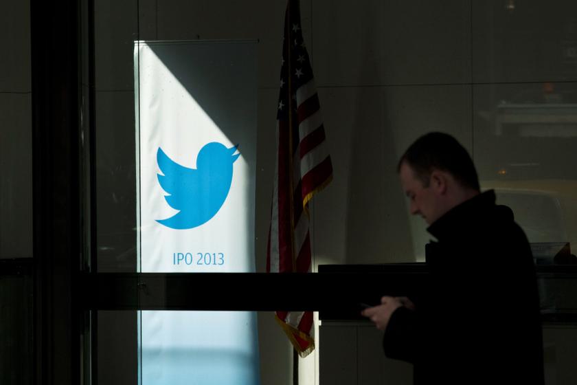 A man walks past a Twitter banner while leaving JP Morgan headquarters, before the firm's IPO in New York, October 25, 2013. u00e2u20acu201du00c2u00a0Reuters pic