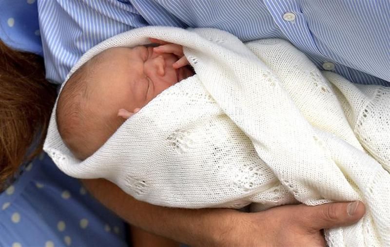 In the arms of Prince William.