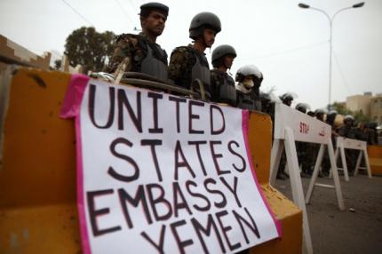 Riot policemen stand guard during a protest to demand the release of Yemeni detainees in the prison of Guantanamo Bay, outside the US embassy in Sanaa in this June 17, 2013, file photo. u00e2u20acu201d Reuters pic