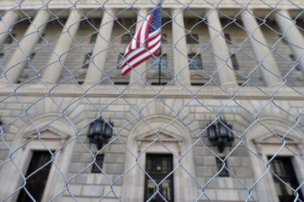 A fence surrounds the US Department of Commerce in Washington October 5, 2013, as the government shutdown continues into the weekend. u00e2u20acu201d Reuters pic