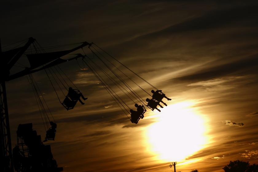 People ride the 'Vertigo' ride as the sun sets at the Cattaraugus County Fair in Little Valley, New York July 31, 2013.  u00e2u20acu201c Reuters pic