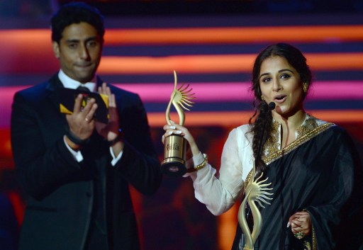 Indian Bollywood actor Abhishek Bachchan (left) looks as actress Vidya Balan speaks after winning the award for u00e2u20acu0153Best Actor u00e2u20acu201d Femaleu00e2u20acu009d. u00e2u20acu201d AFP pic