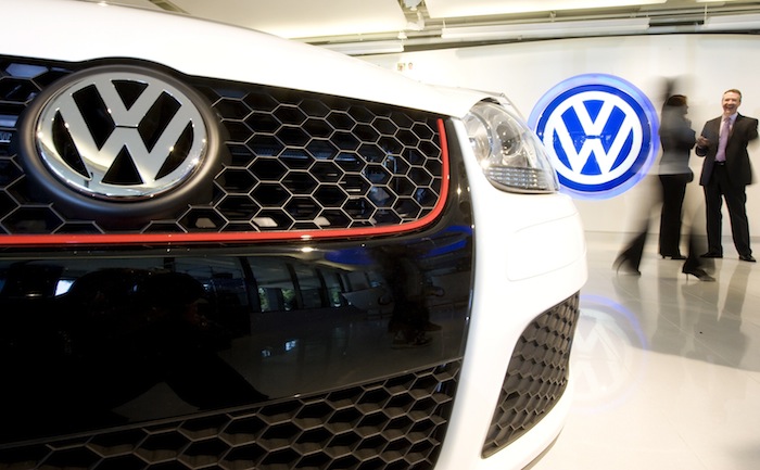 File photo of a Volkswagen logo sign next to the grill of a 2009 GTI automobile inside the lobby of the US headquarters building of Volkswagen Group of America in Herndon, Virginia, September 18, 2008. u00e2u20acu201d Reuters pic