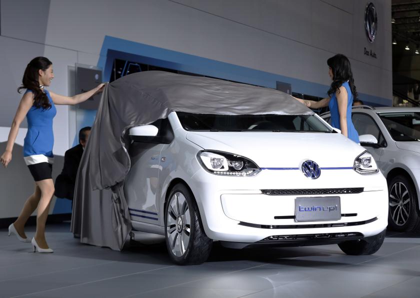 Models unveil Volkswagenu00e2u20acu2122s plug-in hybrid Twin Up! concept car during a presentation at the 43rd Tokyo Motor Show in Tokyo November 20, 2013. u00e2u20acu2022 Reuters pic