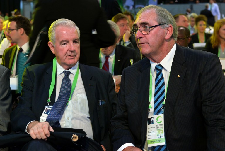 A file picture taken on November 13, 2013 in Johannesburg shows John Fahey (right), the former president of the World Anti-Doping Agency (WADA) speaking with Craig Reedie, (left) the new president of WADA. u00e2u20acu201d AFP pic