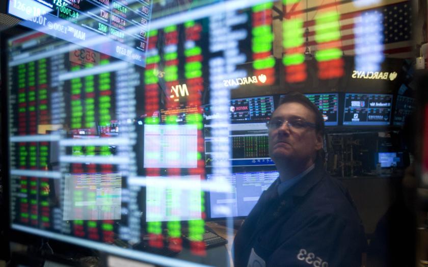 A trader is reflected in a screen as he works on the floor of the New York Stock exchange in New York, December 27, 2013. u00e2u20acu201d Reuters pic