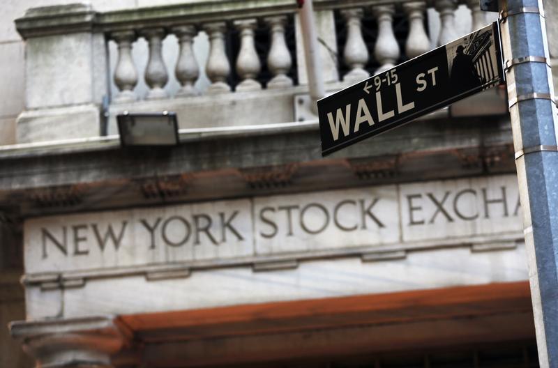 A Wall Street sign is seen in front of the New York Stock Exchange in New York's financial district, March 4, 2013. u00e2u20acu201d Reuters pic