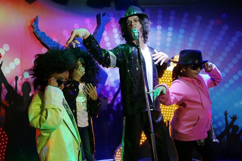 Visitors pose for pictures with a waxwork of Michael Jackson at the Red Carpet Wax Museum, Malaysiau00e2u20acu2122s first all-star interactive wax museum in a 30,000 sq ft Oscar awards-like setting in i-city, Shah Alam. u00e2u20acu201c Picture by Choo Choy May