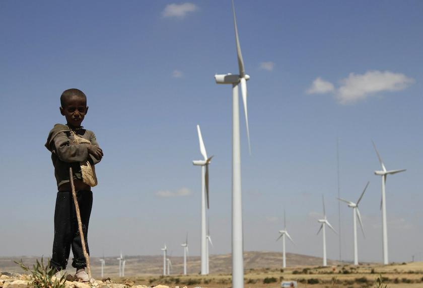 A boy stands in front of wind turbines at the Ashegoda Wind Farm, near a village in Mekelle, Tigray, 780km north of Addis Ababa October 26, 2013. u00e2u20acu201d Reuters pic 
