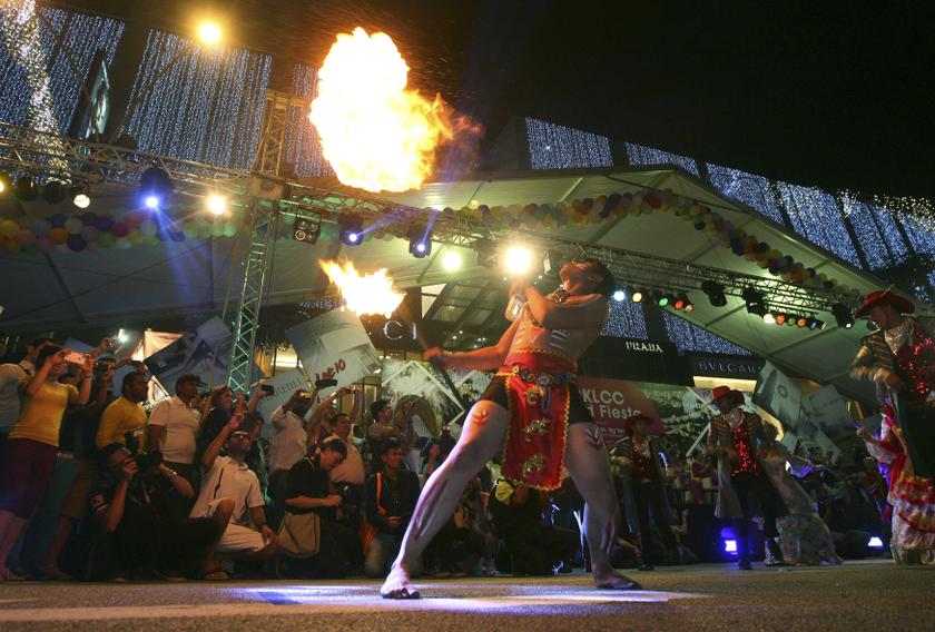A man performs during the World Fiesta street parade, a promotional event by the Malaysian Tourism Board, in Kuala Lumpur December 28, 2013. u00e2u20acu201d Reuters pic