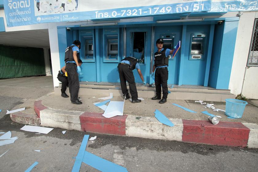 Policemen inspect the site of a bomb blast at an ATM machine in the southern province of Yala October 9, 2013. Reuters pic